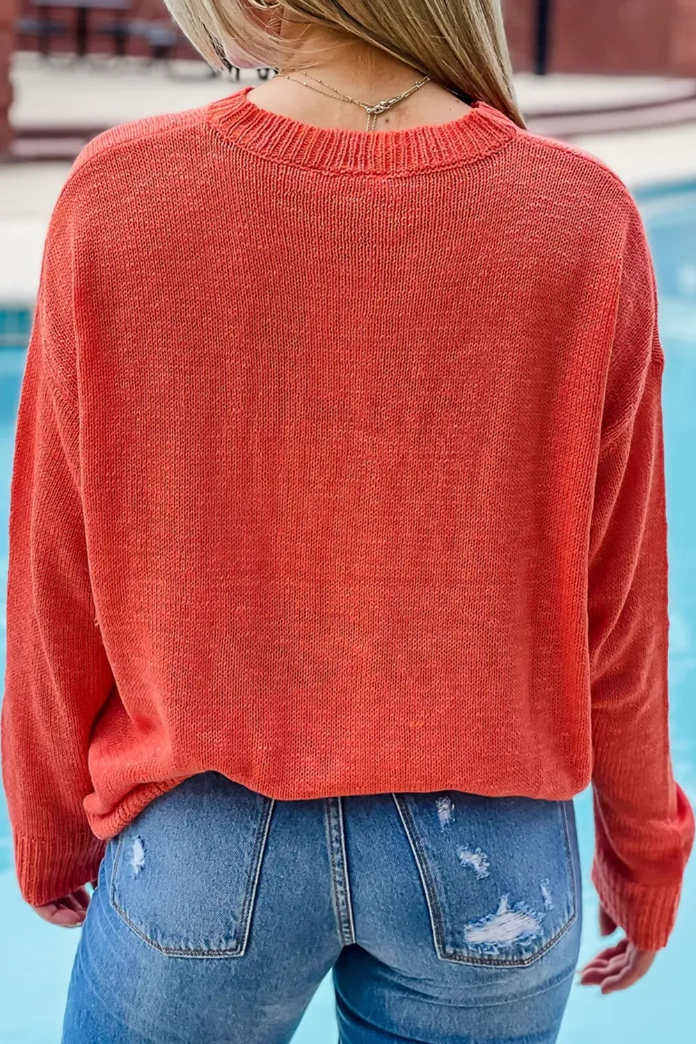 Red and orange letter sweater