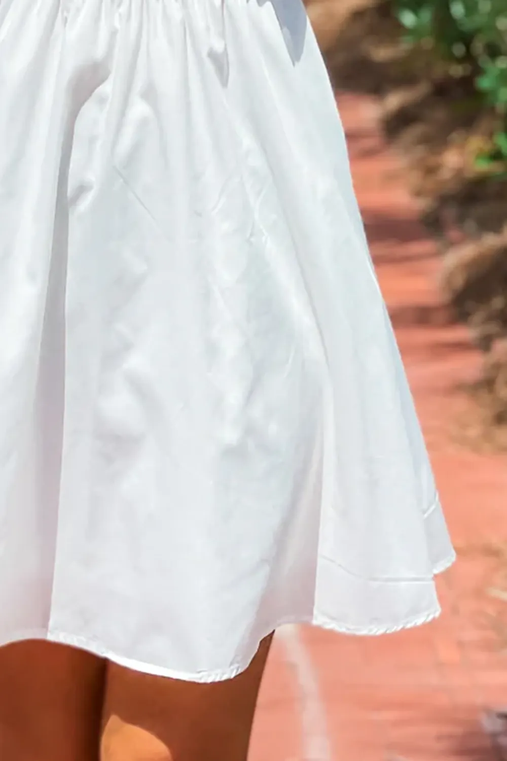 Short dress with bow tie at back